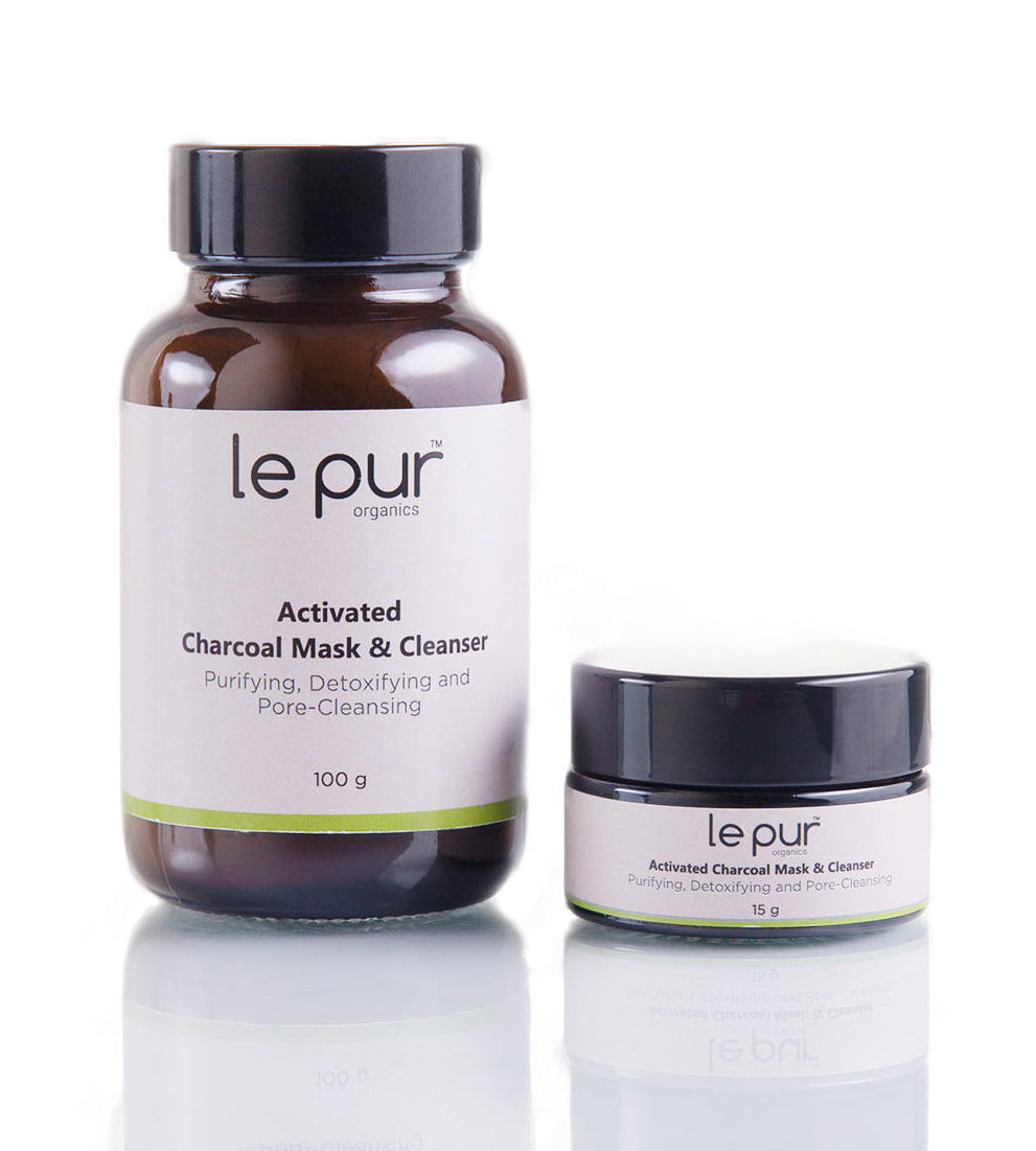 Le Pur Organics activated charcoal mask cleanser trial pack with black mask spread on skin, promoting deep cleansing and detoxification.