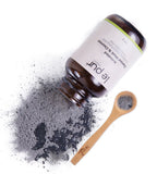 Le Pur Organics activated charcoal mask cleanser trial pack featuring a black clay mask in a small jar with a spatula for deep cleansing.