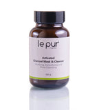Le Pur Organics activated charcoal mask cleanser in a jar, showing the black, clay-like facial mask for deep cleansing and detoxifying skin.