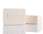 Le Pur Organics Blanch Beauty organic skincare product in a sleek bottle with natural ingredients visible.