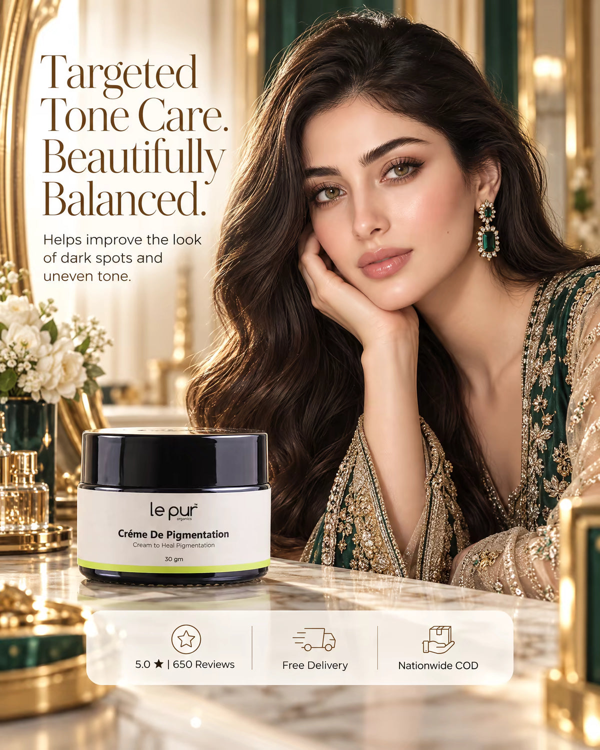 A woman in an ornate green and gold embroidered dress rests her head on her hand beside a jar of Le Pur Crème De Pigmentation on a marble surface. Large promotional text reads 'Targeted Tone Care.