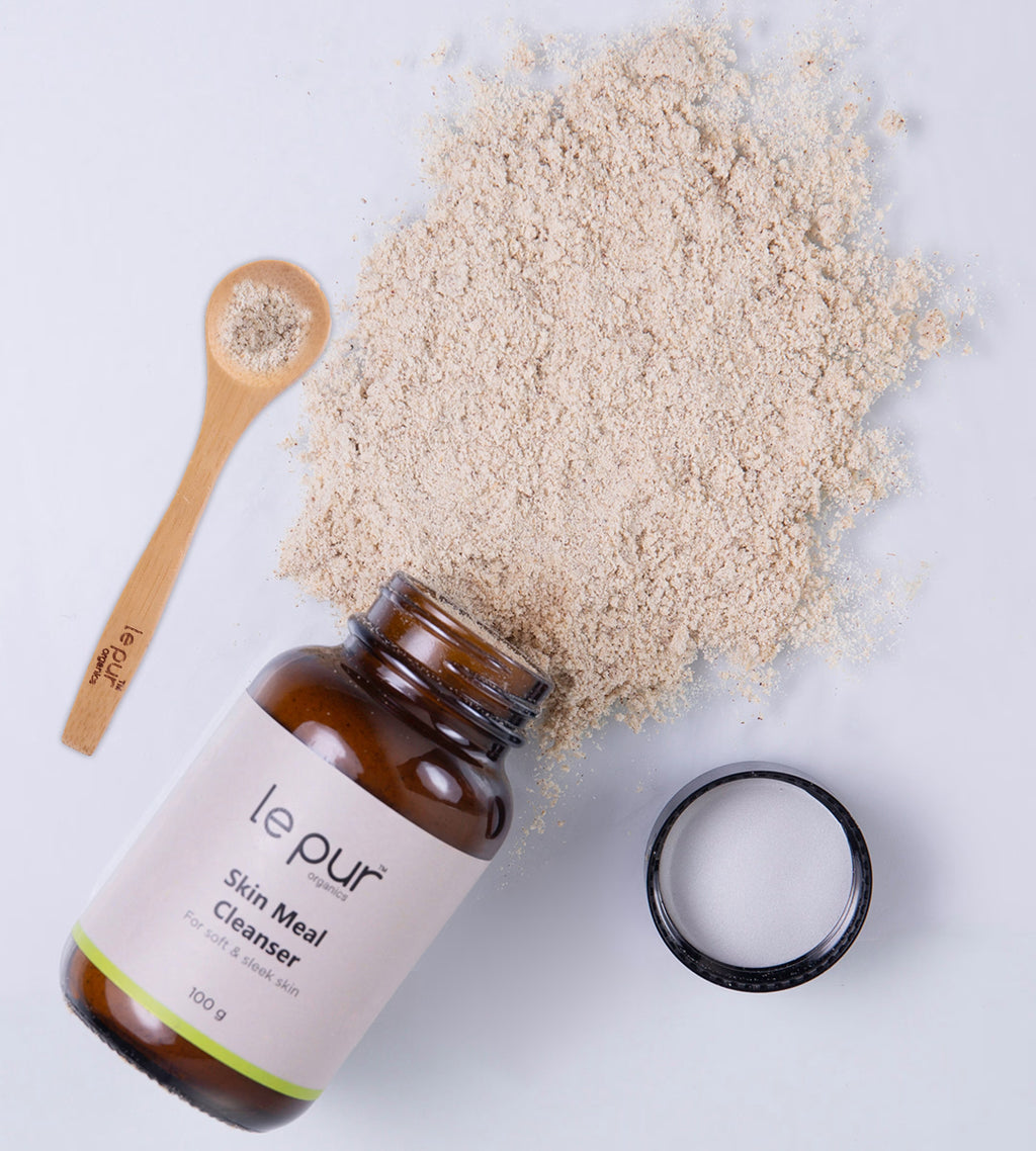 Le Pur Organics Skin Meal Cleanser in a clear bottle with a white pump, showing its gentle, organic facial cleanser formula.