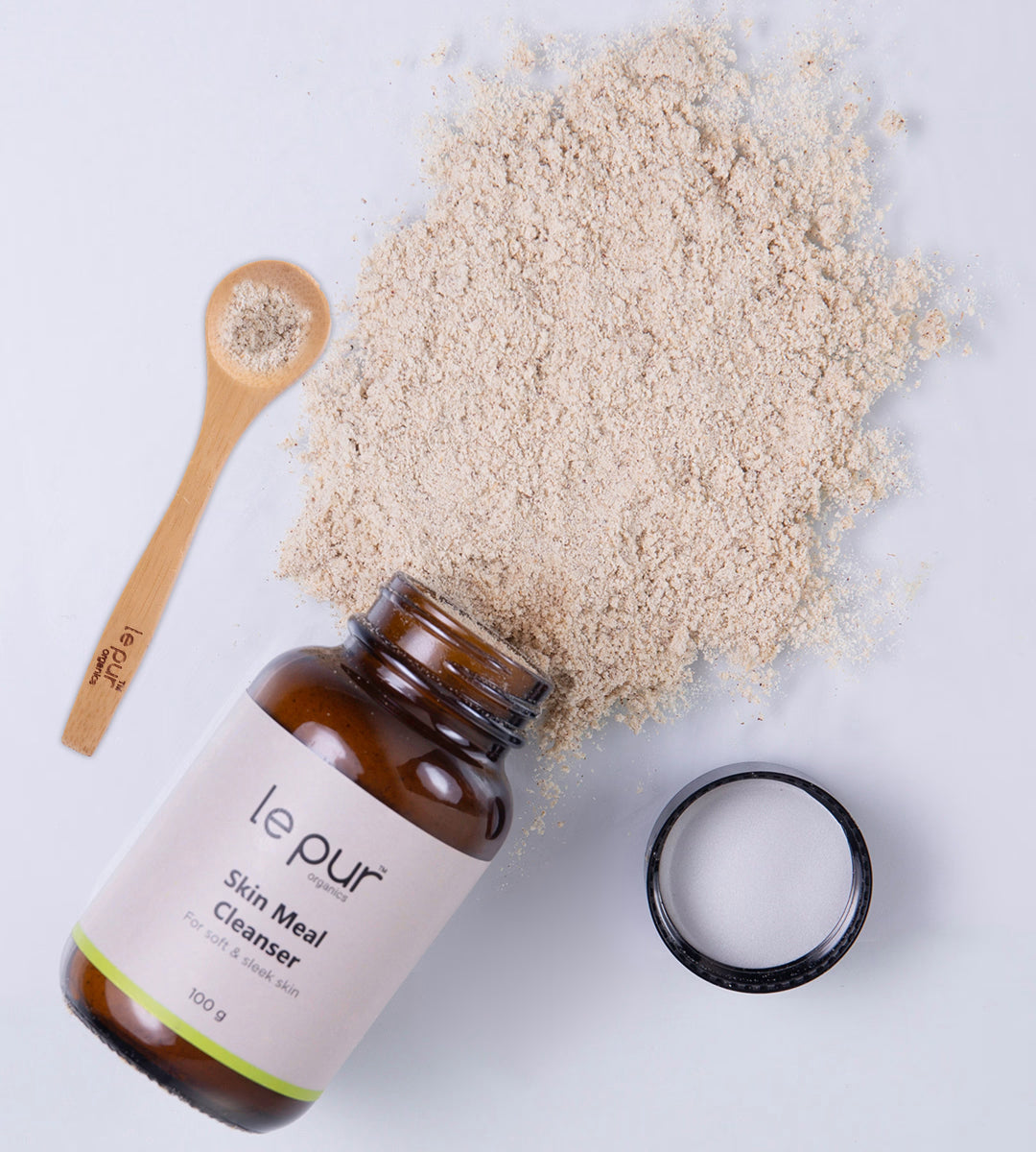 Le Pur Organics Skin Meal Cleanser in a clear bottle with a white pump, showing its gentle, organic facial cleanser formula.