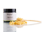 Organic sugar scrub by Le Pur Organics showing a jar of exfoliating sugar scrub with natural ingredients and textured surface.