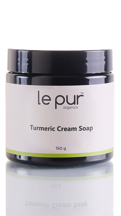 Le Pur Organics turmeric cream soap bar showing a natural, creamy soap with turmeric extract for organic skincare.