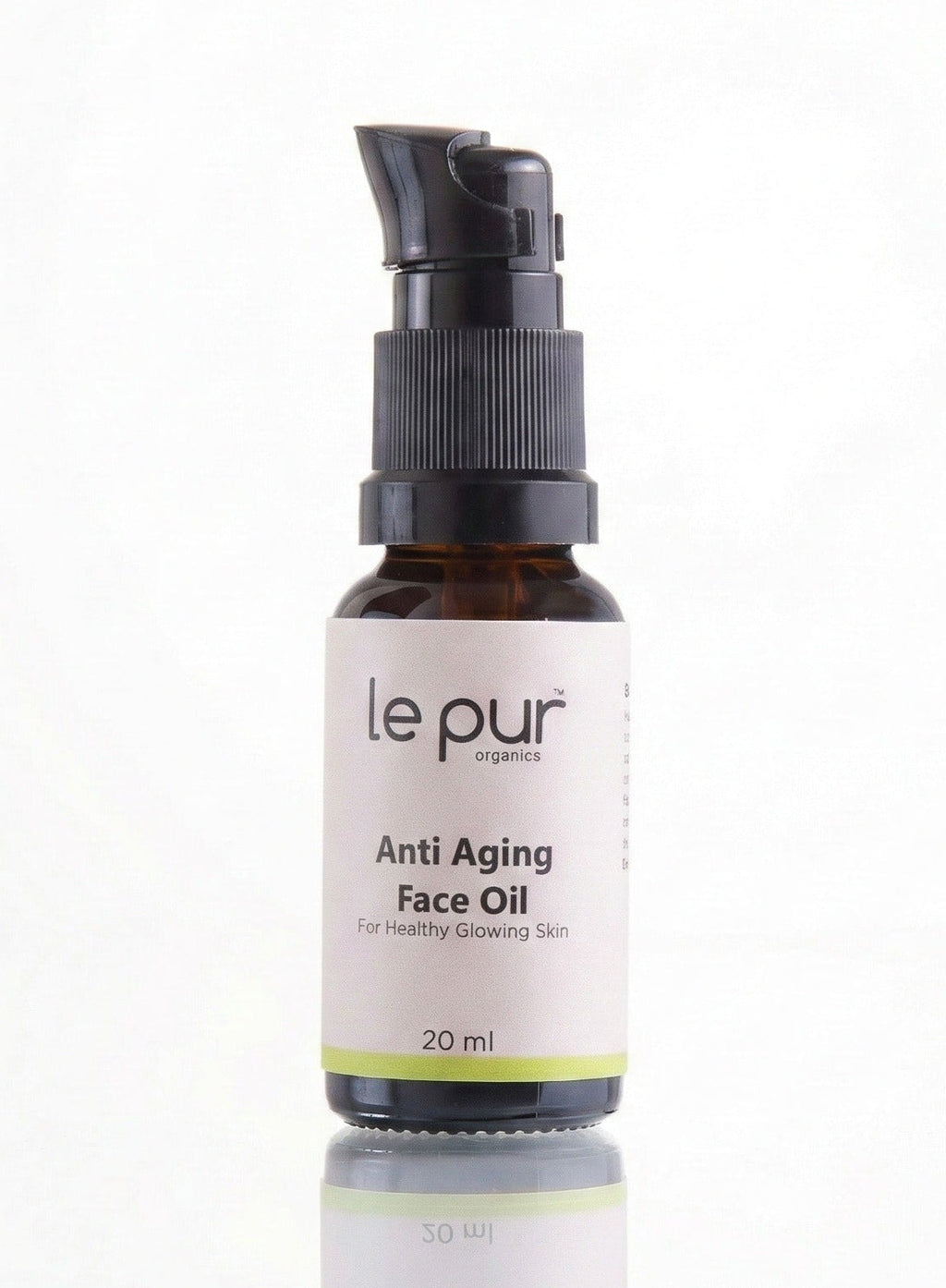 Le Pur Organics age defying face oil bottle with dropper, featuring sleek packaging and organic skincare  Ingredient visual featuring Sea Buckthorn and CoQ10 alongside Age Defying Face Oil bottle. 