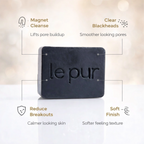 Black Beauty charcoal soap bar lathered in hands showing rich foam for a deep clean without a heavy feel